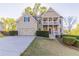 Charming home featuring a welcoming front porch, well-manicured lawn, and convenient two-car garage at 288 Pine Way, Dallas, GA 30157