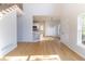 Open-concept layout with hardwood floors, seamlessly connecting the living area and kitchen at 288 Pine Way, Dallas, GA 30157