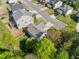 Residential aerial view showcasing a well-maintained house, yard, and neighborhood layout on a sunny day at 3835 New Salem Ct, Cumming, GA 30040