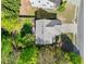Aerial view of a well-maintained home showcasing its roof, driveway, and surrounding greenery at 3835 New Salem Ct, Cumming, GA 30040