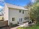 Backyard featuring a well maintained lawn, brick patio, and a grill at 3835 New Salem Ct, Cumming, GA 30040