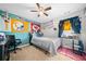 Bedroom with sports team decor, desk, and ceiling fan at 3835 New Salem Ct, Cumming, GA 30040