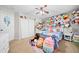 Bright bedroom with ceiling fan and a charming collection of plush animals at 3835 New Salem Ct, Cumming, GA 30040