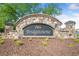 Stone entrance sign for Bridgetowne community with lush landscaping at 3835 New Salem Ct, Cumming, GA 30040