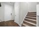 Entryway with hardwood floors, staircase, and white trim at 3835 New Salem Ct, Cumming, GA 30040