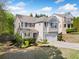 Beautiful home with a well-maintained lawn and charming curb appeal on a sunny day at 3835 New Salem Ct, Cumming, GA 30040