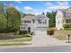 Inviting two-story home featuring manicured lawn and a spacious two-car garage at 3835 New Salem Ct, Cumming, GA 30040