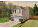 View of the side of this home with a manicured lawn and inviting curb appeal at 3835 New Salem Ct, Cumming, GA 30040