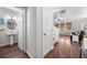 Hallway leading to the living room with a view of a conveniently located half-bath at 3835 New Salem Ct, Cumming, GA 30040