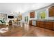 Open concept kitchen and dining area with stainless appliances and hardwood floors at 3835 New Salem Ct, Cumming, GA 30040