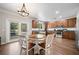 Spacious kitchen and eating area with wood cabinets and stainless appliances at 3835 New Salem Ct, Cumming, GA 30040