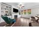 Cozy living room with built-in shelving, fireplace and hardwood floors at 3835 New Salem Ct, Cumming, GA 30040