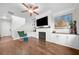 Cozy living room featuring a fireplace, built-in shelves, and hardwood floors at 3835 New Salem Ct, Cumming, GA 30040