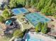 Aerial view of community tennis courts, playground, and green spaces at 3835 New Salem Ct, Cumming, GA 30040