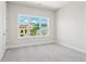Bright bedroom featuring a neutral color palette, large window, and plush carpeting at 685 Summitt Hill Way, Cumming, GA 30040