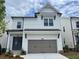 Charming two-story home with a welcoming front facade and a two-car garage at 685 Summitt Hill Way, Cumming, GA 30040
