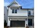 Charming two-story home featuring a gray garage door and a well-manicured front yard at 685 Summitt Hill Way, Cumming, GA 30040