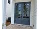 Elegant home entrance with stylish double doors and a brick-paved porch at 685 Summitt Hill Way, Cumming, GA 30040