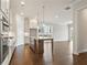 Open-concept kitchen featuring a large island, stainless steel appliances, and modern cabinetry at 685 Summitt Hill Way, Cumming, GA 30040
