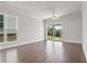 Bright living room features a sliding glass door leading to the backyard and ample natural light at 685 Summitt Hill Way, Cumming, GA 30040