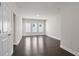 Open-concept living area features hardwood floors and lots of natural light at 685 Summitt Hill Way, Cumming, GA 30040