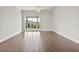 Bright living room featuring hardwood floors and sliding glass doors that provide access to the backyard at 685 Summitt Hill Way, Cumming, GA 30040
