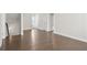 Bright living room featuring hardwood floors and white trim at 685 Summitt Hill Way, Cumming, GA 30040