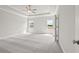 Spacious main bedroom with tray ceiling, soft carpet, and bright windows at 685 Summitt Hill Way, Cumming, GA 30040