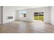 Bright living room boasts wood-look floors, a modern fireplace, and sliding door to the backyard at 1020 Sutherland Lane (Lot 41), Lawrenceville, GA 30043