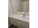 Bathroom vanity with a mirror, sink, and storage, offering a functional layout at 1234 Pinedale Nw Cir, Conyers, GA 30012