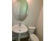 Powder room with pedestal sink and neutral walls providing a functional space at 1234 Pinedale Nw Cir, Conyers, GA 30012