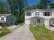 Charming townhome with a well-manicured front yard and attached one car garage, perfect for comfortable living at 1234 Pinedale Nw Cir, Conyers, GA 30012