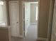 Hallway with closet doors and neutral walls, providing a practical layout to the bedrooms at 1234 Pinedale Nw Cir, Conyers, GA 30012