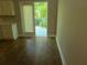 The kitchen features access to the deck, and has laminate flooring and neutral colored walls at 1234 Pinedale Nw Cir, Conyers, GA 30012