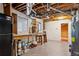 Unfinished basement featuring a work bench, paint cans and a separate room at 1721 Hudson Woods Trl, Decatur, GA 30033