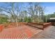 Large wooden deck surrounded by mature trees, ideal for outdoor entertaining and relaxation at 1721 Hudson Woods Trl, Decatur, GA 30033