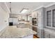 Kitchen featuring updated cabinets, stone countertops, stainless steel appliances, and an island at 1721 Hudson Woods Trl, Decatur, GA 30033