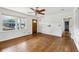 Bright living room with hardwood floors, large windows, and a view of the front yard and entry at 1721 Hudson Woods Trl, Decatur, GA 30033