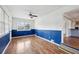 Bright living room featuring hardwood floors, a ceiling fan, and a large window for natural light at 1721 Hudson Woods Trl, Decatur, GA 30033