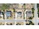 Bird's-eye view of several homes, highlighting manicured lawns and neighborhood layout with mature trees at 2358 New Salem Trce, Marietta, GA 30064