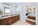 Bathroom with double vanities and a glimpse into the main bedroom at 2358 New Salem Trce, Marietta, GA 30064