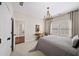 Chandelier-lit bedroom with plantation shutters, neutral walls, and plush carpeting for ultimate comfort at 2358 New Salem Trce, Marietta, GA 30064