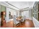 Inviting dining room with a farmhouse table, chandelier, and views into the foyer at 2358 New Salem Trce, Marietta, GA 30064