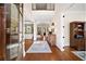 Elegant foyer featuring gleaming hardwood floors, high ceilings, and a view of the staircase at 2358 New Salem Trce, Marietta, GA 30064