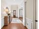 Welcoming foyer with hardwood floors, high ceilings, an area rug, and decorative console table creates an inviting entrance at 2358 New Salem Trce, Marietta, GA 30064