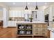 Close-up of a rustic kitchen island with white countertops and ample storage at 2358 New Salem Trce, Marietta, GA 30064