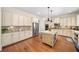 Spacious kitchen with a center island, stainless steel appliances, and custom cabinetry at 2358 New Salem Trce, Marietta, GA 30064