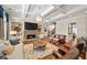Inviting living room featuring built-in shelving, hardwood floors, a stone fireplace, and lots of natural light at 2358 New Salem Trce, Marietta, GA 30064