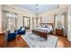 Serene main bedroom with a trey ceiling, sitting area, hardwood floors, and plantation shutters at 2358 New Salem Trce, Marietta, GA 30064