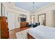 Stylish main bedroom with blue ceiling, wood floors, dresser, and sitting area at 2358 New Salem Trce, Marietta, GA 30064